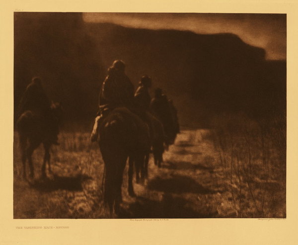 Edward S. Curtis - Plate 001 The Vanishing Race - Navaho - Vintage Photogravure - Portfolio, 18 x 22 inches - This image was captured in 1907, 1/3 of the way through the 1897 – 1927 project. No other photogravure makes this significant statement. When one understands the expansive nature of Edward Sheriff Curtis’ study and his focus on the character of the people, the evocative nature of this very image is felt as a story, not just another “snapshot” of Indians on horseback. <br> <br>The importance of his documentation are the portraits from North American Indian life that capture the individual people groups, their character and their culture. “Vanishing Race” makes the statement for all. <br> <br>“The thought, which this picture is meant to convey, is that the Indians as a race, already shorn in their tribal strength and stripped of their primitive dress, are passing into the darkness of an unknown future. Feeling that the picture expresses so much of the thought that inspired the entire work, the author has chosen it as the first of the series.” – Edward Curtis