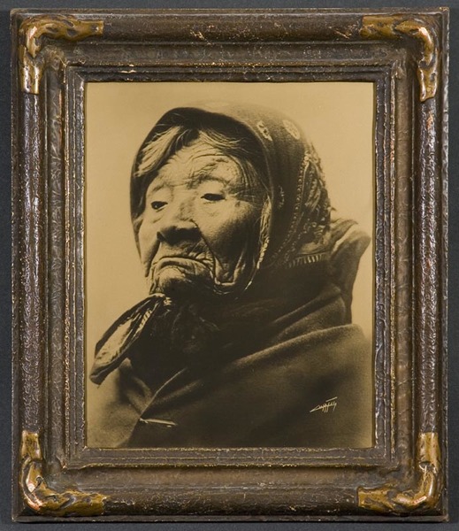 This is one of only two known examples of this image to exist. It is a variation of the published image. Description by Curtis: This aged woman, daughter of Chief Seattle, was for many years a familiar figure in the streets of Seattle.