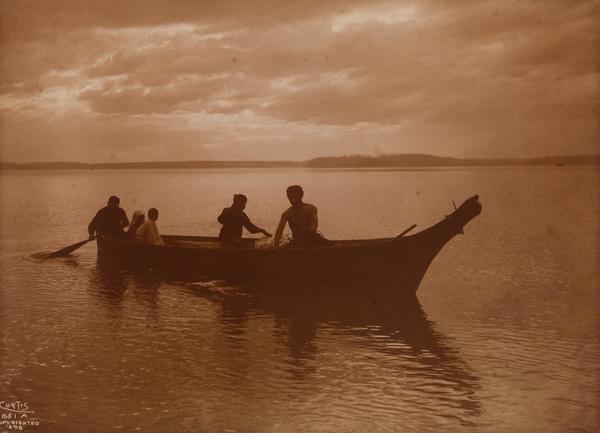 Edward S. Curtis - Homeward (Puget Sound) - Gold-toned Printing-out print - 5 5/8 x 7.81 in. (14.29 x 19.84 cm.) - In negative at lower left: 851 A <br>Copyright info in negative at lower left: COPYRIGHTED 1898 <br> <br>Provenance: Edward S. Curtis Studio, Seattle <br>Private Collection(s) <br> <br>Publication History - Image: <br>The North American Indian (1907-1930), Portfolio 9, Plate 318 <br>Native Family, Bulfinch/Callaway Editions, 1996, Page 80-81 <br>Sacred Legacy: Edward S. Curtis and the North American Indian, Simon & Schuster, 2000, Title Page, 172