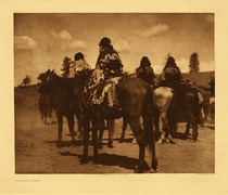 Edward S. Curtis -   Plate 025   Jicarilla Women - Vintage Photogravure - Portfolio, 18 x 22 inches - Edward Curtis describes this piece as: Women watching the races on their annual ceremonial or feast day. It will be observed that they are all dressed uniformly in garments cut after the primitive mode. This is the 25th piece in “The North American Indian” a project which represents the final compilation of decades of field photography and research by Edward S. Curtis who labored under Morgan’s patronage for 23 years, from 1907 - 1930, to complete the series.