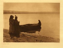 Edward S. Curtis - Plate 253 Kutenai Girls - Vintage Photogravure - Portfolio, 18 x 22 inches - Three young Kutenai girls stand beside their canoe on the shore of the lake.  Each is wearing a long dress and have their backs toward the camera. This is great image of the beautifully built Kutenai Canoes. The background fades into distant trees and hills.
<br>
<br> "The Kutenai are not known to be linguistically related to any other tribe... It may be concluded, therefore, that in at least comparatively early times the Kutenai tribe lost its unity, and the resultant bands spread southward across the narrow divide between the Columbia and the Kootenay and down the later river." – Edward Curtis
<br>
<br>"The reservation Kutenai in the United States have profited even less than most tribes by association with civilization. A more ragged, filthy, idle, and altogether hopeless-looking community of ophlamic and crippled gamblers it would be difficult to find on a reservation. Their degradation is the more regrettable since the Kutenai physiognomy seems to promise much. It is far less heavy and gross than the Plains type or the types of the surrounding plateau area. It is such as one associates with intelligence and character and one cannot escape the feeling that an opportunity was lost when the Kutenai were permitted to sink to their present level."- Edward S. Curtis