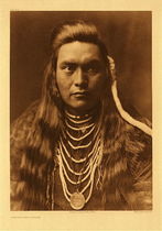 Edward S. Curtis - *50% OFF OPPORTUNITY* Plate 264 Lawyer - Nez Perce - Vintage Photogravure - Portfolio, 22 x 18 inches - The original of this portrait is a member of the family of that Lawyer who played a prominent part in the Nez Perce affairs in the years following the treaty of 1855. - Edward Curtis Caption
<br>
<br>"The Nez Perce began his preparations for spiritual obtainment almost in infancy. The child, either boy or girl, when less than ten years of age was told by the father or the mother that it was time to have 'tiwatitmas' - spiritual power... What a picture of Indian character this affords: a mere infant starting out alone into the fastness of the mountain wilds, to commune with the spirits of the infinite, a tiny child sitting through the night on a lonely mountain, reaching out its infant's hands to God." - Edward S. Curtis in "The North American Indian", Volume VIII