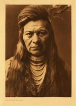 Edward S. Curtis - Plate 265 Black Eagle - Nez Perce - Vintage Photogravure - Portfolio, 22 x 18 inches - At the age of 16, Black Eagle, a big strong Indian worked alongside Chief Joseph in the uprising of 1877. He demanded respect and got it. 
<br>
<br>There is a tale regarding Black Eagles ability with horses, and one in particular. When he left the reservation and joined a rodeo, he left behind a horse with which he had a special relationship. A young man attempted to catch this horse many times, but did not succeed. When Black Eagle returned, he called the horses name, whistled and held out his hat. The horse immediately approached and put his nose the hat. 
<br>
<br>The “pompadour”, seen in many of Edward Curtis portraits, replaced the archetypal look of two braids with bangs worn prior to the 1890’s.