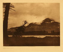 Edward S. Curtis - *50% OFF OPPORTUNITY* Plate 287 Evening on the Columbia - Vintage Photogravure - Portfolio, 18 x 22 inches - A spur of the Cascade mountains occupies the background. 
<br>– Edward Curtis
<br>
<br>From this same viewpoint the mountains could be found covered in snow. During severe winter weather, the Wishham took refuge in dwellings completely underground. “The entrance was by means of a ladder in a narrow passageway, and as there was no other opening, fire could not be built within. Cooking, therefore, was done outside or in another house, and the only light possible was an occasional cedar torch.” From The North American Indian, Volume 8.