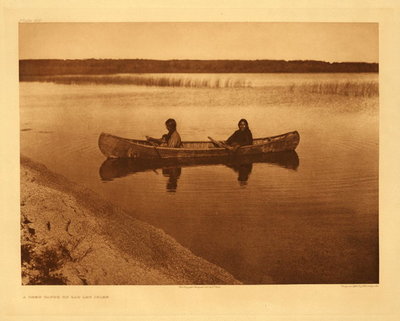Edward S. Curtis - Plate 621 A Cree Canoe on Lac Les Isle - Vintage Photogravure - Portfolio, 18 x 22 inches - The occupants of this canoe are two women who are likely to have travelled by water as a faster means than walking in their watered territory which is in the northern prairies near Lake Winnepeg, the Peace river, Athabasca lake, and Churchill river.
<br>
<br>The Cree have been (at the time of Curtis) in friendly contact with the white race since the early years of the seventeenth century, and the intimacy of this relation may be judged from the fact that no other Indian language of North America has proved so prolific a source of Anglicized terms as have Cree and certain closely allied Algonquian dialects of New England and eastern Canada.