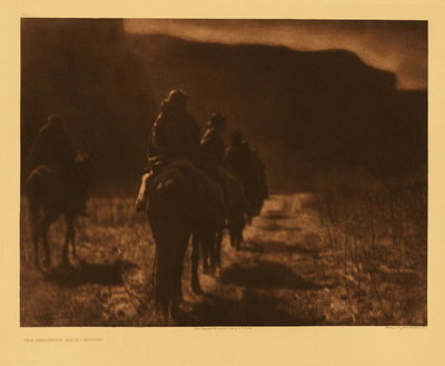 Edward S. Curtis -   Plate 001 The Vanishing Race - Navaho - Vintage Photogravure - Portfolio, 18 x 22 inches - This image was captured in 1907, 1/3 of the way through the 1897 – 1927 project. No other photogravure makes this significant statement. When one understands the expansive nature of Edward Sheriff Curtis’ study and his focus on the character of the people, the evocative nature of this very image is felt as a story, not just another “snapshot” of Indians on horseback.
<br>
<br>The importance of his documentation are the portraits from North American Indian life that capture the individual people groups, their character and their culture. “Vanishing Race” makes the statement for all. 
<br>
<br>“The thought, which this picture is meant to convey, is that the Indians as a race, already shorn in their tribal strength and stripped of their primitive dress, are passing into the darkness of an unknown future. Feeling that the picture expresses so much of the thought that inspired the entire work, the author has chosen it as the first of the series.” – Edward Curtis