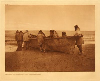 Edward S. Curtis - *50% OFF OPPORTUNITY* Plate 707 Launching a Whale Boat - Cape Prince of Whales - Vintage Photogravure - Portfolio, 18 x 22 inches - Portfolio 20. The Alaskan Eskimo. The Nunivak. The Eskimo of Hooper Bay. The Eskimo of King Island. The Eskimo of Little Diomede Island. The Eskimo of Cape Prince of Wales. The Kotzebue Eskimo. The Noatak. The Kobuk. The Selawik. 
<br>
<br>Written by Curtis: The Eskimo of the Alaskan coast are expert whale-hunters, even with such seemingly flimsy skin craft as that shown here and in Plate 709.