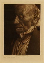 Edward S. Curtis -   Blue Horse -  Ogalala - Vintage Photogravure - Volume, 12.5 x 9.5 inches - Born about 1830. He led five war-parties against Ute, Shoshoni, Bannock, and Piegan. A prominent chief for many years, who boasts that he has always been opposed to war with the white people.
