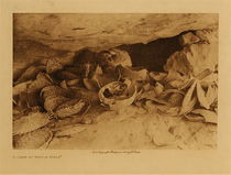 Edward S. Curtis - *50% OFF OPPORTUNITY* A Cave at Middle Mesa - Vintage Photogravure - Volume, 9.5 x 12.5 inches - In this photograph by Edward S. Curtis remnants of basketry and shards of pottery as strewn about a cave. He claims to have discovered this cave in 1900 near Middle Mesa. The baskets and jars were ceremonial objects and many were intact and even sealed. Edward Curtis said that the circumstances he was under made it impossible to examine the contents. This piece is on display at our Aspen Art Gallery.