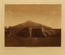 Edward S. Curtis - *50% OFF OPPORTUNITY* Mandan Earthen Lodge - Vintage Photogravure - Volume, 9.5 x 12.5 inches - The typical dwelling of the Mandan is a large earthen lodge exactly like that of the Hidatsa. The erection of the lodge was a community undertaking, and feasting and laughter enlivened the task, which was one of considerable magnitude. The interior arrangements were more complete than was usual in Indian Homes. Between the central fire-pit and the entrance was erected a screen of poles, interwoven with rawhide, extending from the wall to a little beyond the middle. Just inside the door, on one side or both, the horses were stabled. The beds, which were placed between the outer posts and screened with curtains of hides, were made of poles supported at the ends by cross-sticks which rested on two forked posts, the whole piled thickly with robes. The door, consisting of a framework of poles covered with rawhide, was suspended from the lintel so as to swing inward only. To the rawhide covering were fastened several dry buffalo hoofs, so that no one could enter unnoticed.