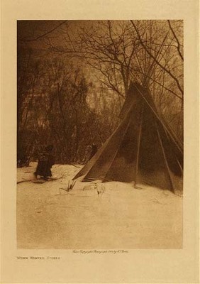 Edward S. Curtis - *50% OFF OPPORTUNITY* When Winter Comes - Vintage Photogravure - Volume, 12.5 x 9.5 inches - Pictured here by photographer Edward Curtis is an example of a winter camp. Winter was tough for almost all tribes, and required preparation by drying meats and preparing a warmer winter lodge. 
<br>
<br>This image was taken in 1908 by photographer Edward S. Curtis and was printed on Japon Vellum. The original photogravure is available for sale in our Aspen Art Gallery.
<br>
<br>Provenance: 
<br>Art Institute of Chicago, Ryerson & Burnham Library