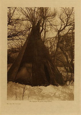 Edward S. Curtis - *50% OFF OPPORTUNITY* In the Mountains - Vintage Photogravure - Volume, 12.5 x 9.5 inches - The Teton Sioux or Lakota Indians would have been located as far West as Montana by the time Edward S. Curtis had the opportunity to photograph the tribe. This photogravure “In the Mountains" may have been taken in the Black Hills. The Sioux would live in portable tipi structures being a seminomadic people they needed to move to follow the buffalo. This camp look to be a winter camp and would be well insulated.
<br>
<br>This photo by Edward S. Curtis was taken in 1908 and printed on Japon Vellum. The piece is available for sale in our Aspen Art Gallery.
<br>
<br>Provenance: 
<br>Art Institute of Chicago, Ryerson & Burnham Library