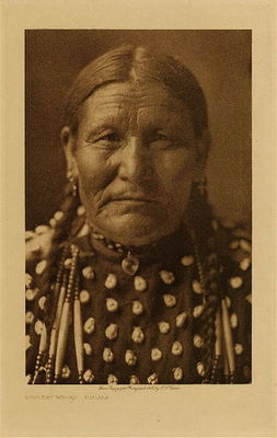 Edward S. Curtis - *50% OFF OPPORTUNITY* Good Day Woman - Ogalala - Vintage Photogravure - Volume, 12.5 x 9.5 inches - "The decorative art of the Lakota found expression on their deerskin garments, pipe-bags, saddle-blankets, robes, parfleches, shields and tipis… There seems to be no fixed motif in many of their designs, each woman reading into her art whatever may be prompted by her thoughts, the same figure sometimes meaning as many different things as there are workers." by Edward S. Curtis in "The North American Indian," Volume III
<br>
<br>Provenance: 
<br>Art Institute of Chicago, Ryerson & Burnham Library
