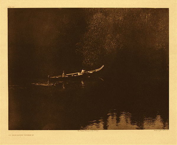 Edward S. Curtis - *40% OFF OPPORTUNITY* Plate 290 On Klickitat River (b) - Vintage Photogravure - Portfolio, 18 x 22 inches - The peaceful part of the river is a contrast to the unseen drama higher up where rock walls narrow and increase the cascade of water that rushes through, creating pools and opportunity for dip-net fishing. The plentiful salmon and steelhead were easy to gather in the pockets formed by the gushing water. <br> <br>"Fish, especially salmon, were plentiful far beyond their needs, and were so easily taken that the people were indolent and inert, lacking the initiative, the energetic force, the manliness characteristic of tribes whose livelihood must be gained largely by hinting. In common with most of the other tribes of the north Pacific coast, they were unusually licentious that chastity was practically unknown; and to a remarkable degree they lacked the tribal instinct, so that killing by hired assassins and by supposed magical means became a recognized practice of frequent occurrence." from Edward S. Curtis' "The North American Indian", Volume VIII