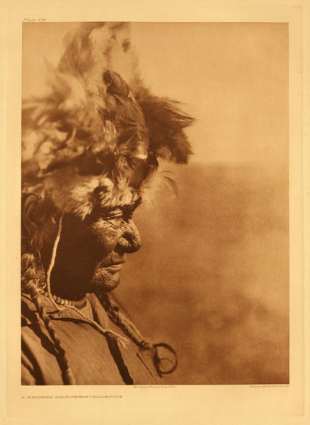 Edward S. Curtis - Plate 638 A Medicine Head-Dress - Blackfoot border=