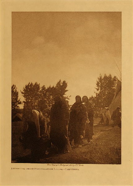 Edward S. Curtis - *50% OFF OPPORTUNITY* Departure From Preparation Lodge - Cheyenne - Vintage Photogravure - Volume, 12.5 x 9.5 inches - The sweat lodge ceremony was very important to the Cheyenne tribes. This image taken by Edward S. Curtis depicts a number of Cheyenne in robes departing from one of the sweat lodges likely for ceremonial purposes. The image was printed for The North American Indian volume VI on Dutch Van Gelder paper. Printed in 1909 by photographer Edward S. Curtis, this piece is now available for sale in our Aspen Art Gallery.