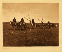 Edward S. Curtis -   Plate 193 Travaux - Piegan - Vintage Photogravure - Portfolio, 18 x 22 inches - Edward Curtis' Description: With the most of the plains tribes the travois was the universal vehicle for transporting camp equipment, but is now rarely seen. In the days before the acquisition of horses a smaller form of the same device was drawn by dogs. The occasion of this picture was the bringing of the sacred tongues to the medicine-lodge ceremony.<br><br>Medicine culture in Native tribes is fascinating. Anyone seeking aid of medicine man would first fill a pipe, take it reverently to his lodge, and lay it on the ground in front of the scaffold. The healer’s acceptance of the case was indicated by smoking the pipe.