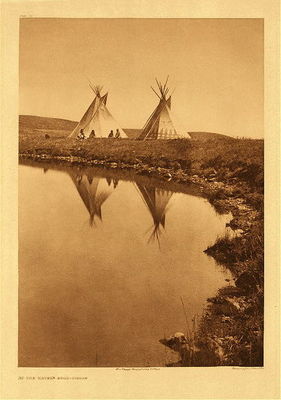 Edward S. Curtis -   Plate 195 At the Water's Edge - Vintage Photogravure - Portfolio, 22 x 18 inches - from Volume VI in "The North American Indian" by Edward S. Curtis:<br><br>"In disposition the Piegan are particularly tractable and likable. One can scarcely find a tribe so satisfactory to work among. In the old days of primitive customs and laws, they were fond of formalities, especially in their social relations, and these exactions were, of course, largely a part of their religion. A noteworthy phase of such form in their daily and hourly life was the excessive use of the pipe."
