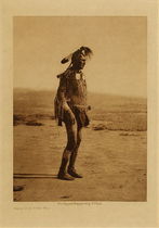  Title: White Man Runs Him (Full Figure) (One of Custer’s Crow Scouts) , Date: 1908 , Size: Volume, 12.5 x 9.5 inches , Medium: Vintage Photogravure , Edition: Vintage