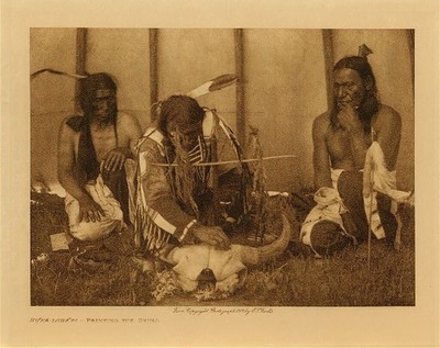  Title:   Huka-Lowapi , Painting the Skull - Sioux , Date: 1907 , Size: Volume, 9.5 x 12.5 inches , Medium: Vintage Photogravure