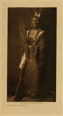 Edward S. Curtis -   Gray Bear - Yanktonai - Vintage Photogravure - Volume, 12.5 x 9.5 inches - Born in South Dakota in 1845. When fourteen years of age he joined a war party, but achieved no honors. He fought against the Hidatsa, running down, while mounted, a horse less warrior and counting first coup. In another raid against the Hidatsa, he successfully captured nine tethered horses on a dark and stormy night. Gray Bear's tutelary deities were the sun and the horses he rode in battle.<br><br>Provenance: <br>Art Institute of Chicago, Ryerson & Burnham Library