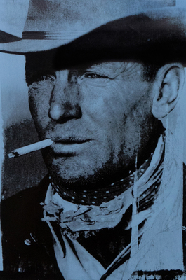 Russell Young - The Cowboy - Acrylic and Oil Screen Print on Linen - 29 1/2 x 19 1/2 inches - Clarence Hailey Long, Jr., often known as C.H. Long (January 9, 1910 – June 29, 1978), was the rugged Texas cowboy sensationalized as the original Marlboro Man. Long, then foreman of the JA Ranch, was catapulted to national attention in 1949, when Life magazine magazine published a series of Leonard McCombe photographs on ranching in the American West. Long was the basis of the popular Marlboro cigarettes advertising campaign for Philip Morris, but other models followed through 1999.<br><br>Long was born in Paducah, the seat of Cottle County in the southern Texas Panhandle. He worked on the 320,000-acre (1,300 km2) JA Ranch southeast of Amarillo and originally established by John George Adair, a native of Ireland, and Charles Goodnight, the best known of the Texas cattlemen. During World War II, Long served in the United States Navy in the South Pacific. The then 39-year-old, 150-pound Long was described as a “silent man, unassuming and shy, to the point of bashfulness [with a] face sunburned to the color of saddle leather [with cowpuncher’s] wrinkles radiating from pale blue eyes.” He wore “a ten-gallon Stetson hat, a bandanna around his neck, a bag of Bull Durham tobacco with its yellow string dangling from his pocket, and blue denim, the fabric of the profession.”<br><br>Long’s Marlboro photographs led to marriage proposals from across the nation, all of which he rejected. In 1951, at forty, Long wed the former Ellen Theresa Rogers (March 21, 1925 – July 29, 2002), a Massachusetts-born nurse who came to the JA to care for young Cornelia Wadsworth “Ninia” Ritchie, daughter of ranch manager Montgomery Harrison Wadsworth “Montie” Ritchie. The Longs had five sons: Clarence, Roger, Walt, Grant, and John.<br><br>His father, C. H. Long, Sr., was in charge of the Hereford herd on the JA, but died when thrown from a bronco. Subsequently, Long Jr. was offered a $20,000 annual contract to advertise beer. His declining of the offer was highlighted in the June 25, 1955, edition of the Baptist Standard newspaper. Long left the JA in 1956.<br><br>Long’s tenure at the JA partly paralleled that of Tom Blasingame, known as the oldest cowboy in the American West, having died at the age of ninety-one in 1989, after having worked in ranching for seventy-three years.<br><br>Long joked that “If it weren’t for a good horse, a woman would be the sweetest thing in the world.”